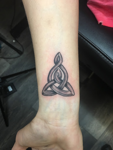 Explore tool band tattoo ideas, creative tattoo ideas in Warner Robins, available at Untold Pain Tattoo Studio