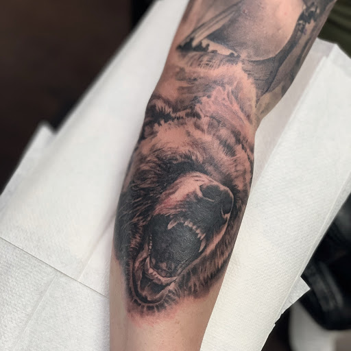 Explore design tattoo ideas for men, creative tattoo ideas in Fontana, available at Iconiq Tattoo Studio