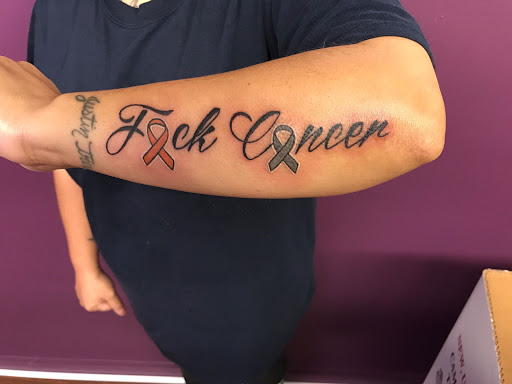 Explore last name back tattoo ideas, creative tattoo ideas in Roscoe, available at Elevated Ink Tattoo