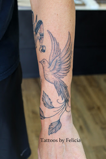 Explore women thigh tattoo ideas, creative tattoo ideas in Fort Myers, available at Tiger Lotus Tattoo and Piercing