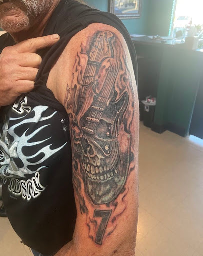 Explore dark skin male black skin tattoo ideas, creative tattoo ideas in Largo, available at Inside Ink Tattoo Studio