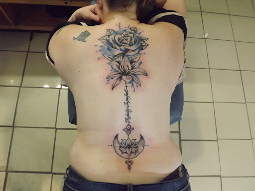 Explore cleavage tattoo ideas, creative tattoo ideas in Princeton, available at Custom Dreams Tattooing and Body Piercing