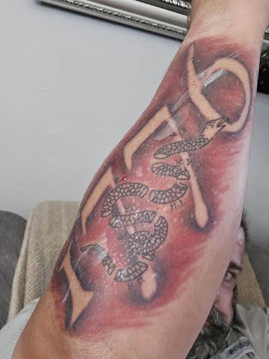 Explore hellscape battle sleeve tattoo ideas, creative tattoo ideas in Titusville, available at Davinci Tattoo