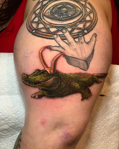 Explore cover up tattoo ideas for lower back, creative tattoo ideas in Seaside, available at Sacred 8 Studios