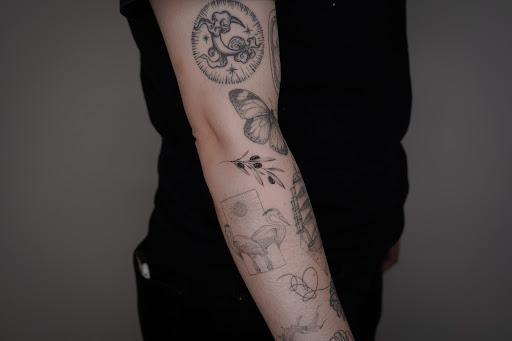 Explore tattoo ideas for breast cancer ribbon, creative tattoo ideas in New York, available at UPLIFT TATTOO & PIERCING NYC