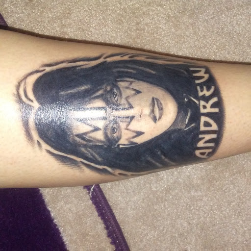 Find tattoo ideas for under the breast for your next unique tattoo in Monroe at Vivid Art Tattoos