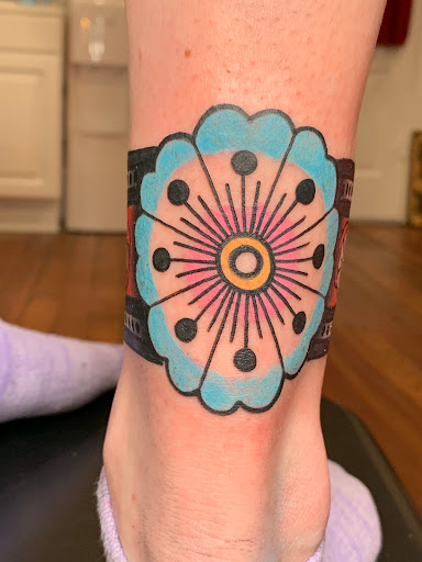 Explore smile tattoo ideas, creative tattoo ideas in Russellville, available at Smoky Row Tattoo