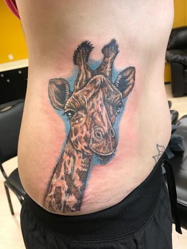 Explore religious elbow tattoo ideas, creative tattoo ideas in Taylor, available at Solid Tattoo LLC