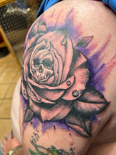 Explore dark skin male black skin tattoo ideas, creative tattoo ideas in Rapid City, available at Convicted Designs Tattoo & Piercing