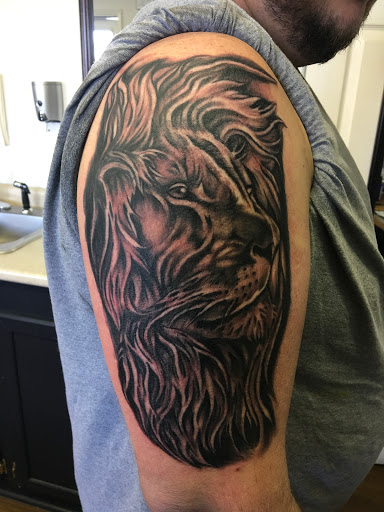 Explore guitar pick tattoo ideas, creative tattoo ideas in Princeton, available at The Asylum Tattoos & Fine Art