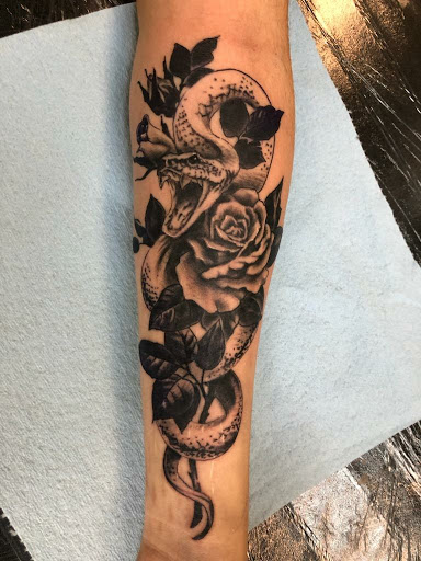 Explore tribal cover up tattoo ideas, creative tattoo ideas in Mckinney, available at Borrowed Time Fine Art Gallery Tattoo Shop