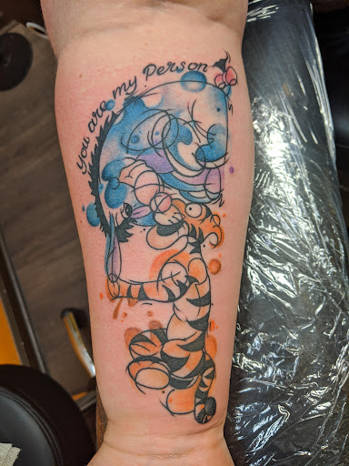 Explore minimalist dog tattoo ideas, creative tattoo ideas in Bucyrus, available at The Tattoo Factory