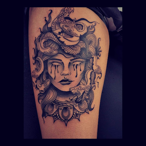 Explore women's spine tattoo ideas, creative tattoo ideas in Redding, available at Dominant Ink