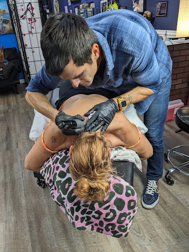 Explore snake sleeve tattoo ideas, creative tattoo ideas in Palm Harbor, available at High Quality Tattoo Studios