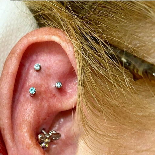 Explore arsenal tattoo ideas, creative tattoo ideas in North Charleston, available at Exotic Impressions Body Piercing