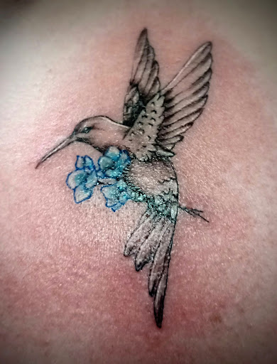 Explore dainty flower tattoo ideas, creative tattoo ideas in Clintonville, available at Temple Ink Tattoo Shop
