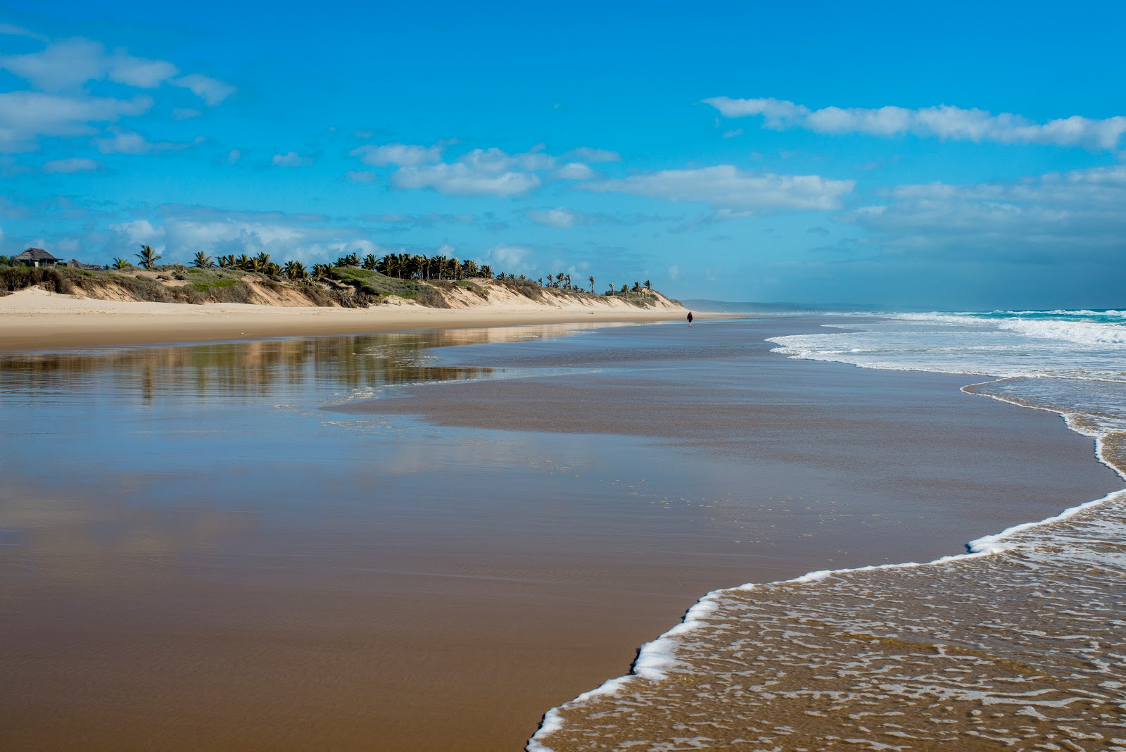 Fotografija Travessia Beach z svetel pesek površino