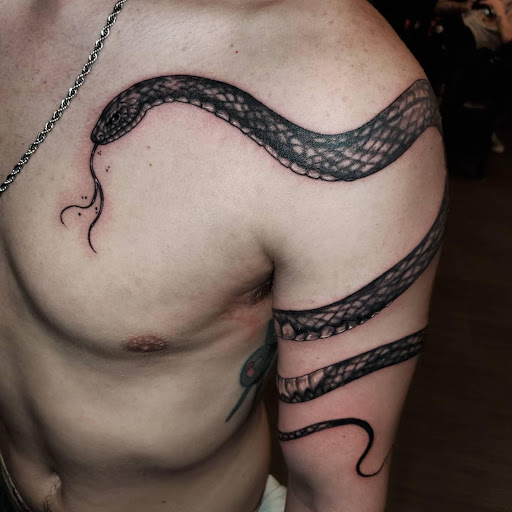 Explore elton john tattoo ideas, creative tattoo ideas in Palm Harbor, available at Angry Owl Tattoo and Piercing