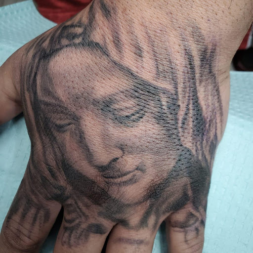 Explore black mens tattoo ideas, creative tattoo ideas in Nashville, available at Titan Tattoo