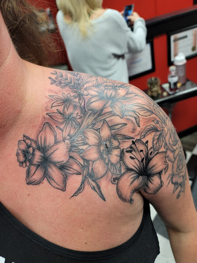 Explore logging tattoo ideas, creative tattoo ideas in Milford, available at Boston John Tattoos