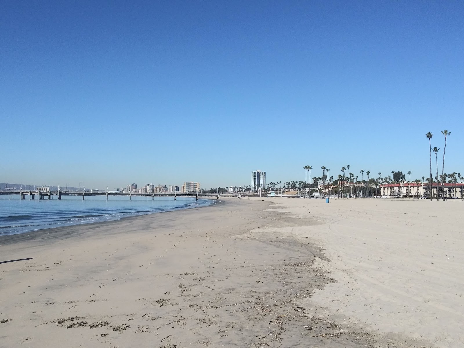 Photo of Belmont Beach with bright sand surface