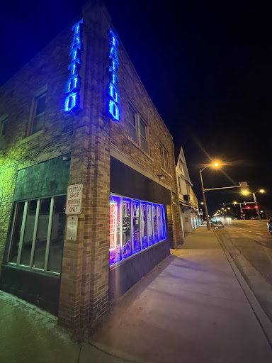 Explore female throat tattoo ideas, creative tattoo ideas in Milwaukee, available at Speakeasy Tattoo Co