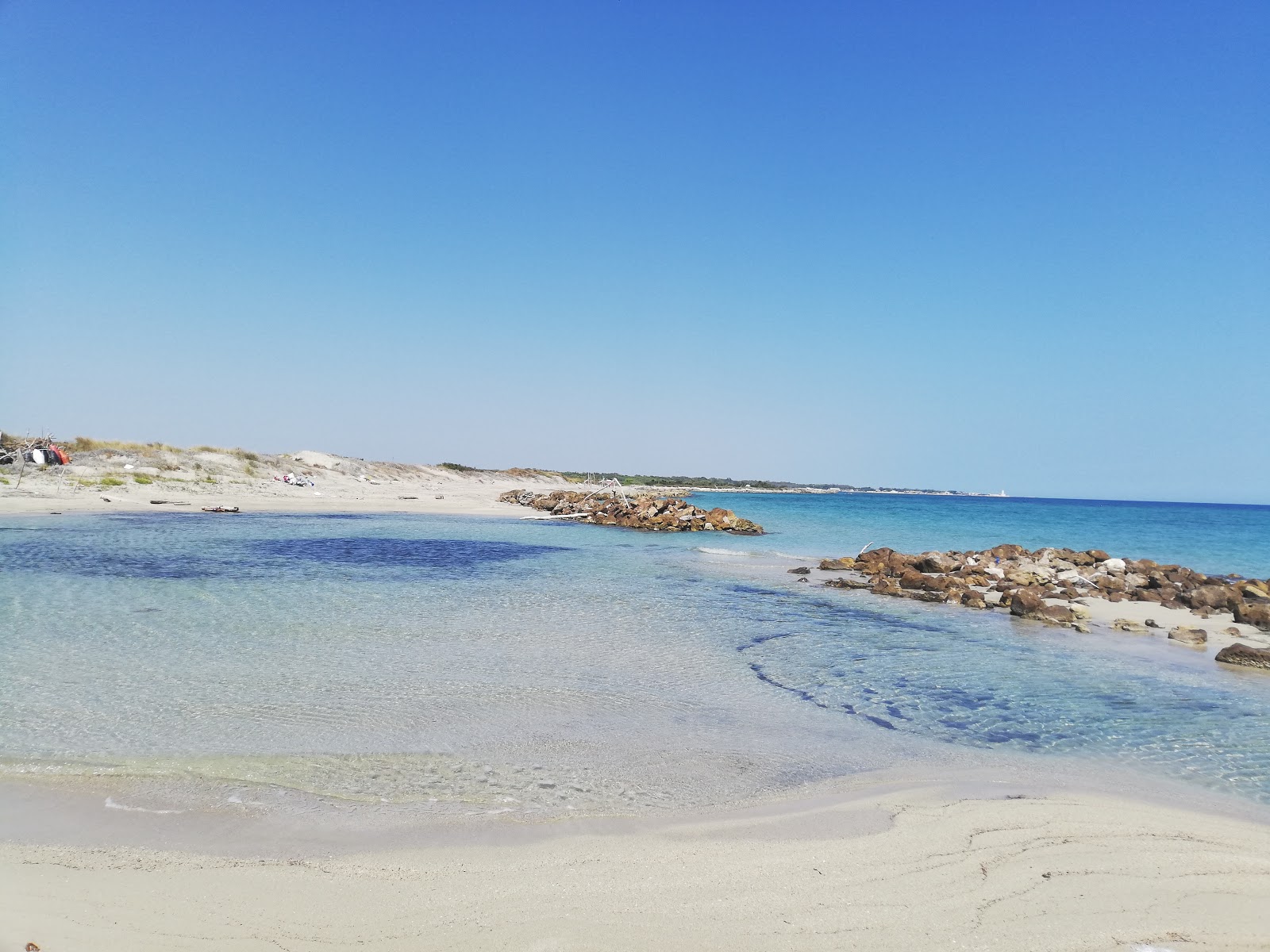 Fotografie cu Cesine beach II cu o suprafață de apă pură albastră