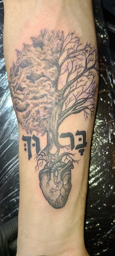 Explore mens back tattoo ideas, creative tattoo ideas in Meadville, available at Lucky Lucys Tattoo and Art Studio