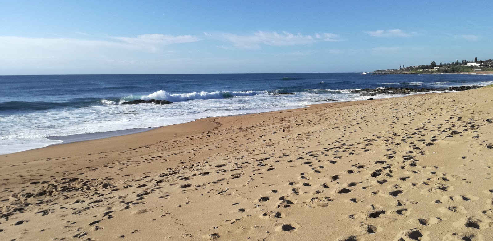 Foto de Pumela beach con arena beige superficie