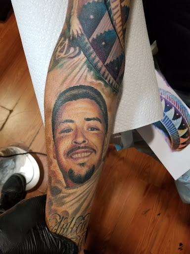 Find guy best friend tattoo ideas for your next unique tattoo in Pueblo at Spellbound Electric Tattoos