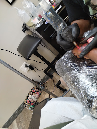 Explore under chin tattoo ideas, creative tattoo ideas in Davenport, available at Fine Ink Studios Tattoos