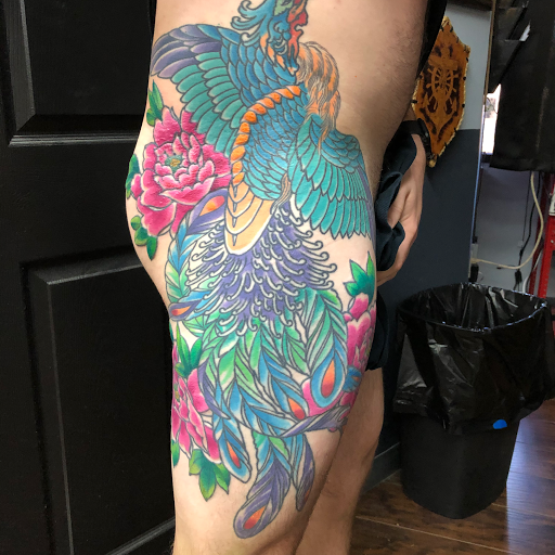 Explore butterfly and rose tattoo ideas, creative tattoo ideas in Jacksonville, available at Idle Hands Tattoo Co.