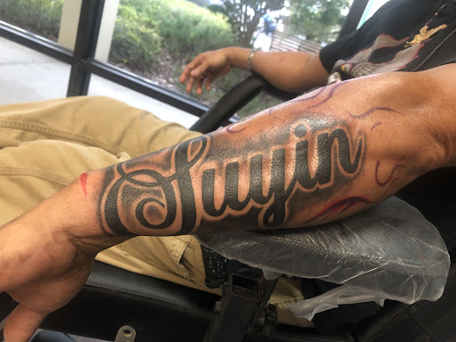 Explore behind neck tattoo ideas, creative tattoo ideas in Lakeland, available at Lyons Den Tattoo Company