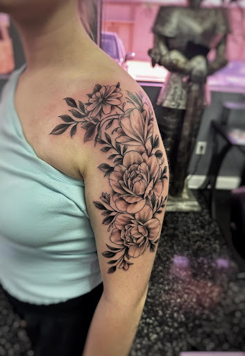 Explore rose tattoo ideas for women, creative tattoo ideas in Fort Myers, available at Loyal 2 The Coil Tattoos & Piercings (Edison Mall Location Entrance F)