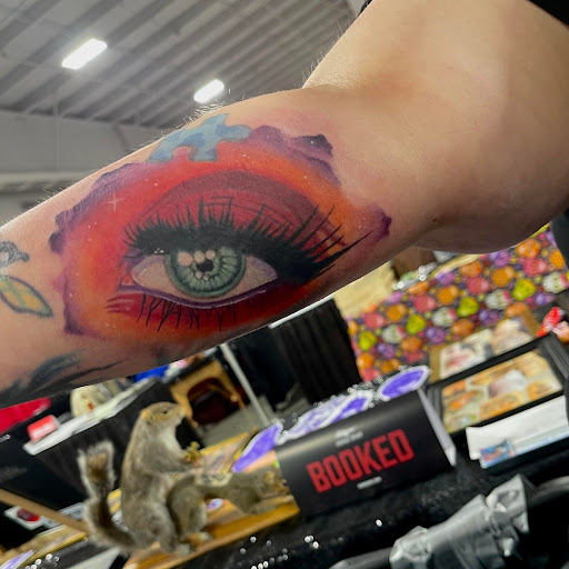 Explore red bird tattoo ideas, creative tattoo ideas in Fort Worth, available at Darkside of Texas Tattoo & Piercing