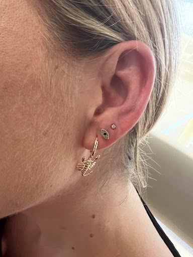 Find tummy tuck tattoo ideas for your next unique tattoo in Delray Beach at Riot Piercing and Permanent Jewelry