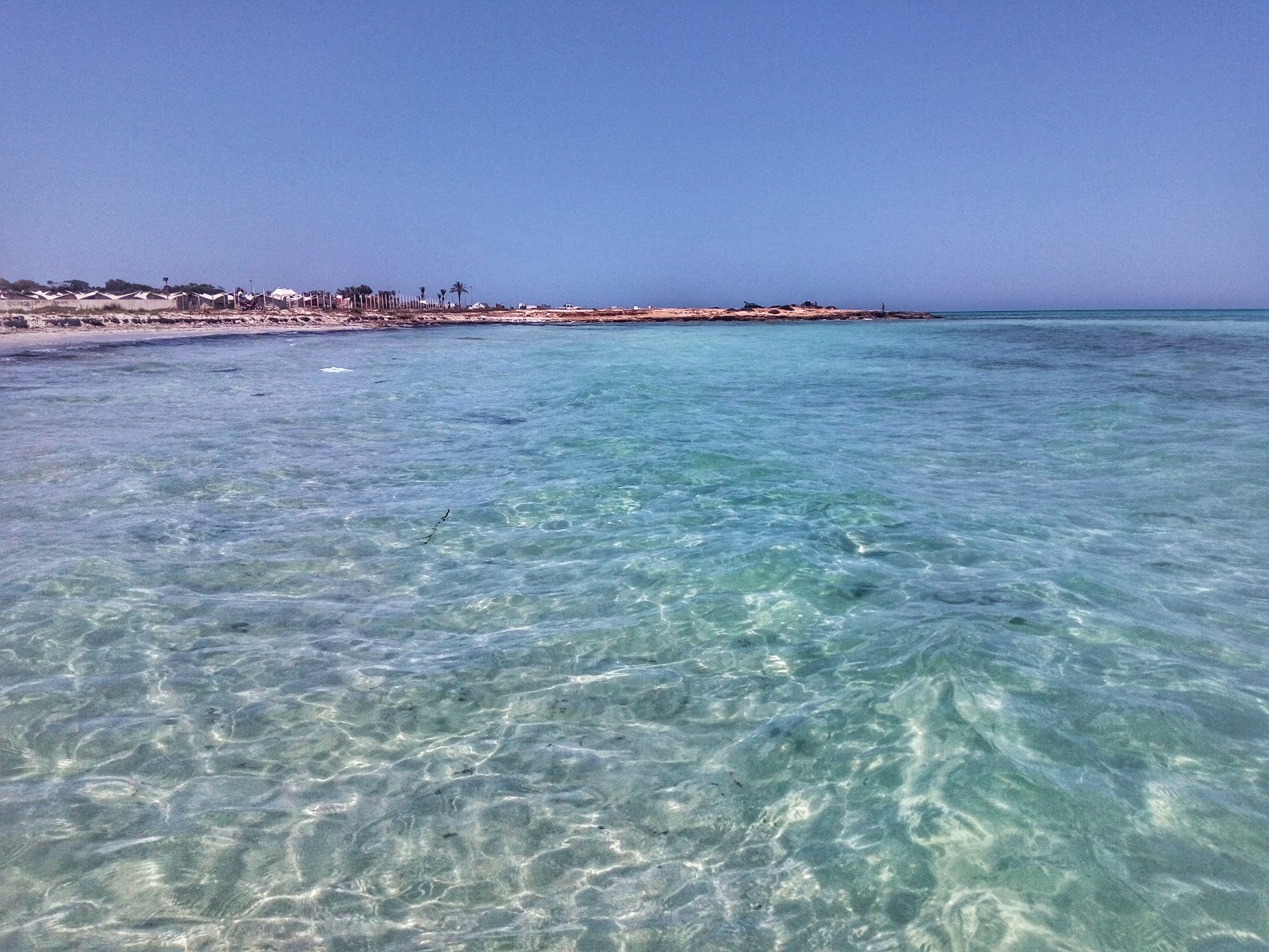 Photo of Chraff beach with turquoise pure water surface