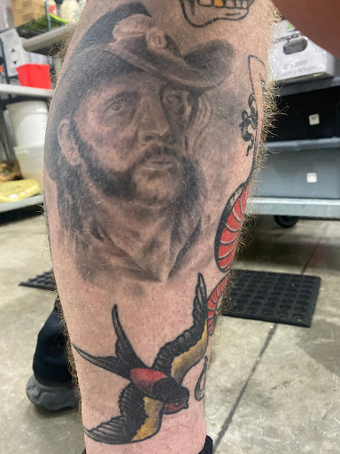 Explore rock climbing tattoo ideas, creative tattoo ideas in Cedar Falls, available at The Iron Quill Tattoo Parlor