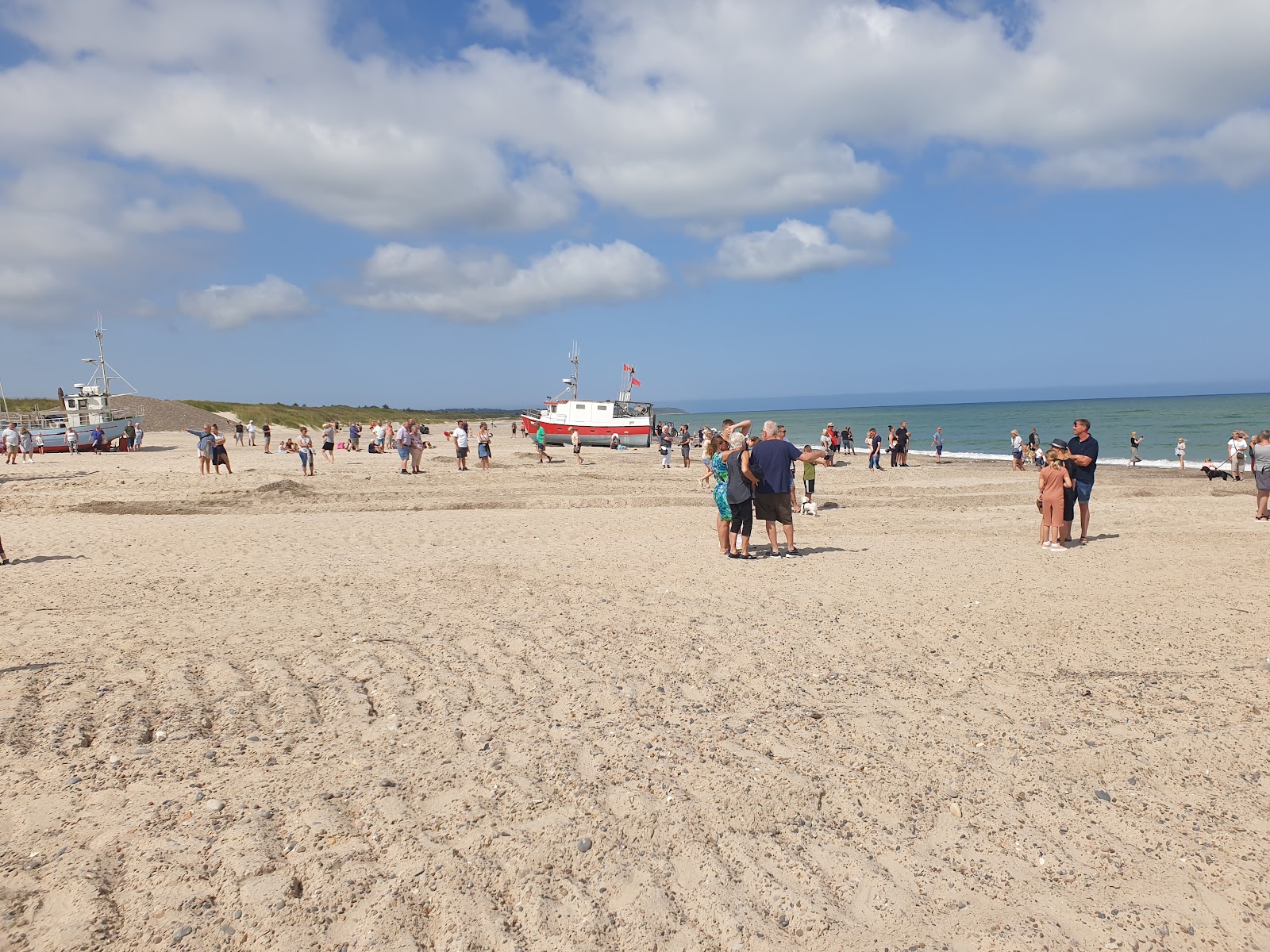 Foto van Thorup Strand met recht en lang