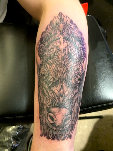 Explore bass fishing tattoo ideas, creative tattoo ideas in Dover, available at Walls of Wonder Tattoo And Body Piercing