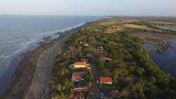 Foto von Puerto Guarare Beach und die siedlung