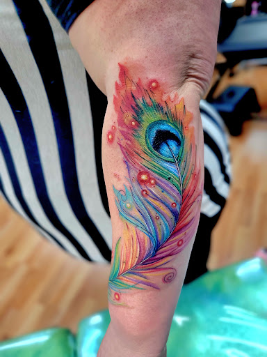 Explore boxing gloves tattoo ideas, creative tattoo ideas in Benton, available at Spectrum Tattoo