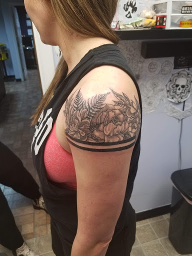 Explore inner bicep tattoo ideas for men, creative tattoo ideas in Knoxville, available at Archangel Custom Ink Tattoo & Piercing