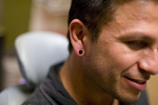 Explore fatherhood tattoo ideas, creative tattoo ideas in Scottsdale, available at Mastodon Professional Body Piercing