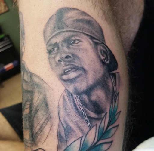 Explore cat and dog tattoo ideas, creative tattoo ideas in Cedar Creek, available at Inkd Out Tattoos
