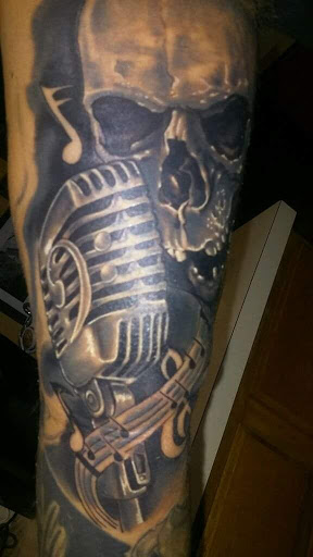 Explore forearm arm tattoo ideas, creative tattoo ideas in Ocoee, available at Slaughterized Ink Tattoo and Piercing Studio