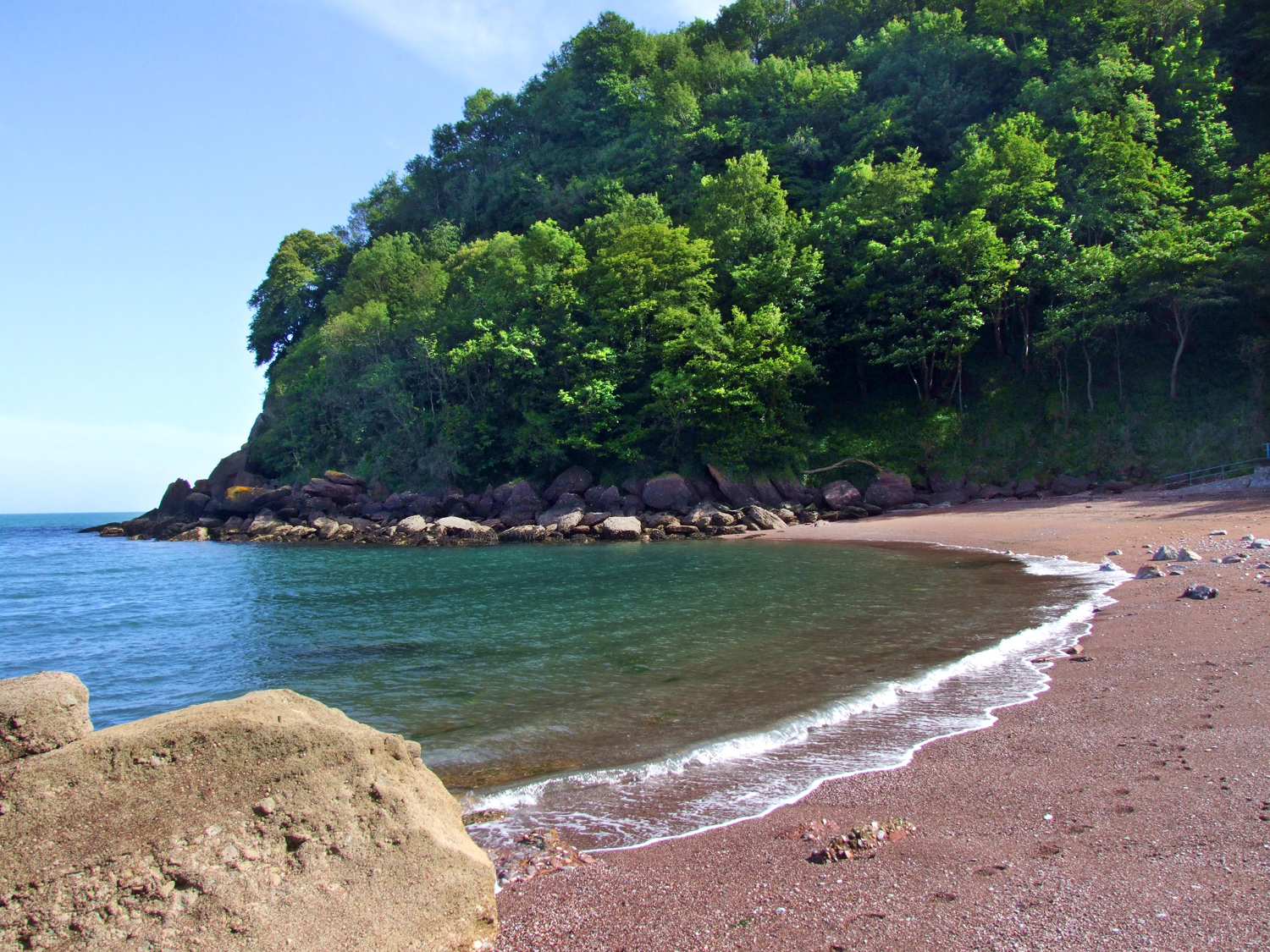 Photo of Watcombe beach with black sand & pebble surface