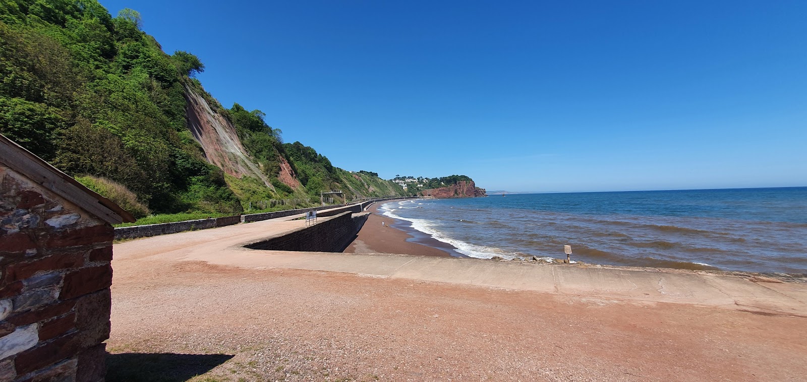 Foto van Holcombe beach met recht en lang