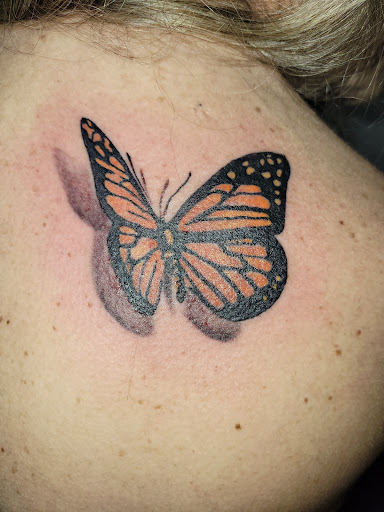 Explore dead dog tattoo ideas, creative tattoo ideas in Angola, available at Hoodlum Ink