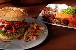 Alitas y Hamburguesas Cajun wings & burgers image